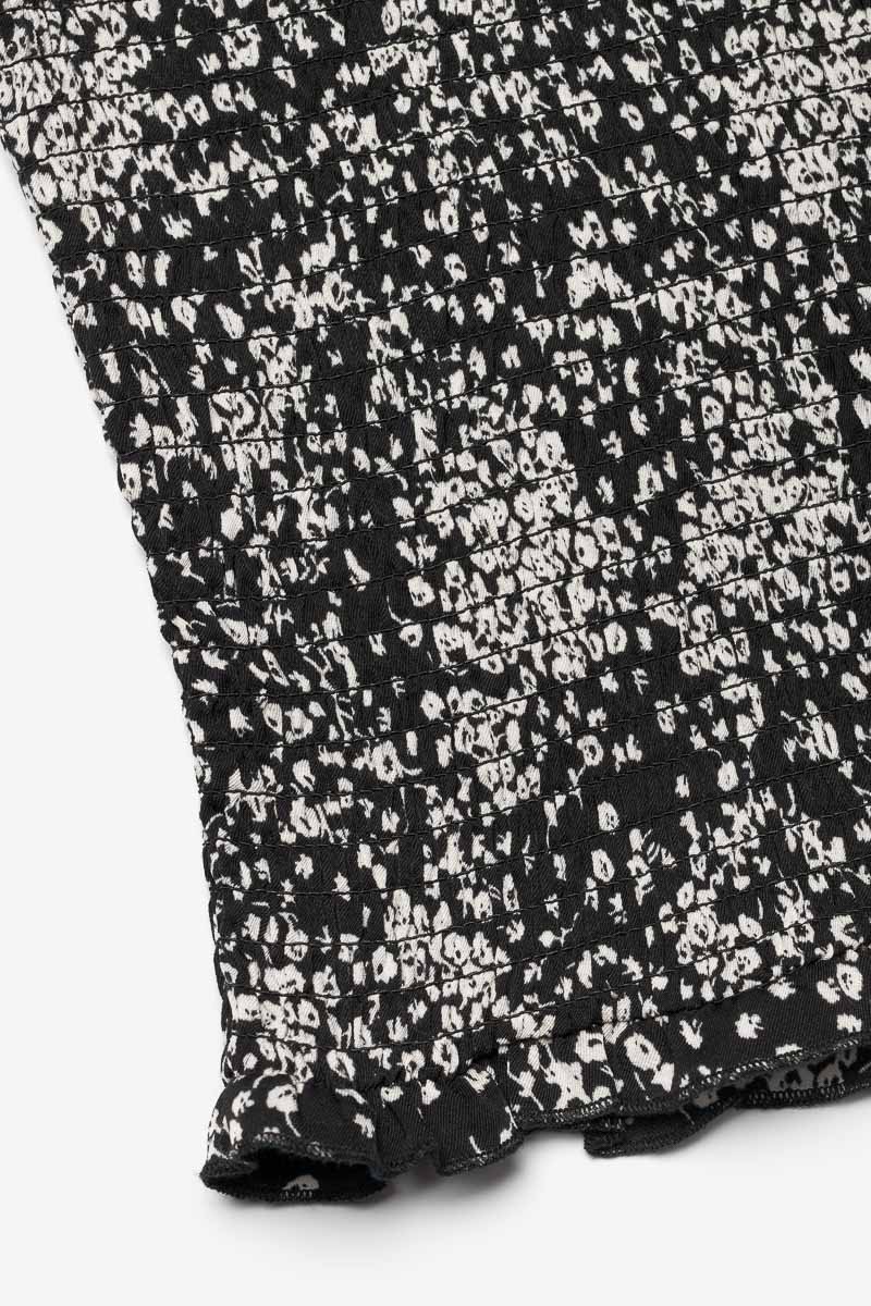 Top Veronicgi à motif floral noir et blanc